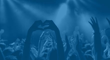 Hands heart in crowd_blue